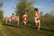 Tonganoxie High's Taylar Morgan, right, leads a pack of runners that includes Tressa Walker and Amanda Shepley Tuesday at the Tonganoxie Invitational, where the Chieftains finished third.
