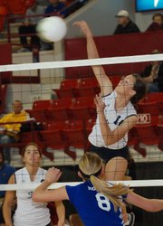 St. James Academy senior left-side hitter Annie Reilly elevates for a kill during the Thunder's state semifinal victory against Holton.