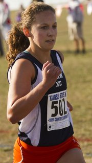 Shawnee Mission Northwest's Jessica Johnson pushes toward the finish line at the Class 6A state championships Saturday at Rim Rock Farm. Johnson was the top SMNW finisher as she placed 12th individually and led the Cougars to the state championship.