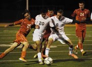 BLHS sophomore Zach Ferguson and senior Trey Kincheloe try to beat BSHS freshman Alex Frank and seniors Dante Crider and Spencer Frank to the ball.