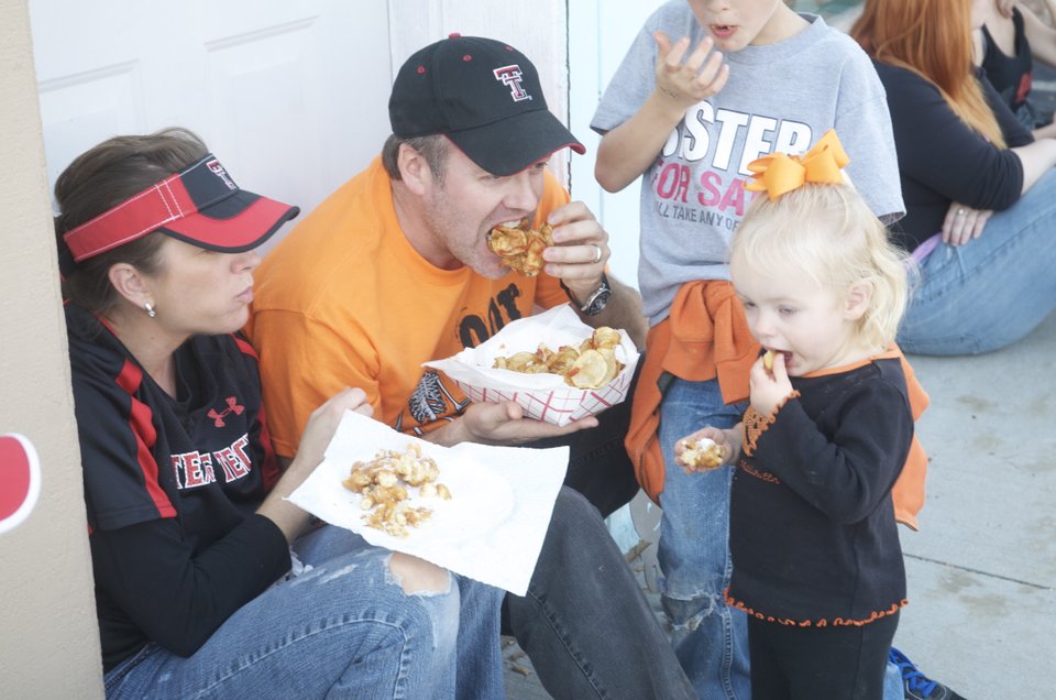 Laura and Chad Killingsworth share funnel cake and fried potatoes ...