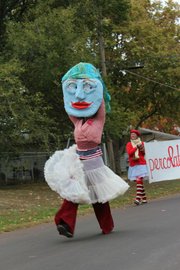Douglas County Arts Caravan artist Rachael Perry dressed as a giant puppet for the EudoraFest parade.