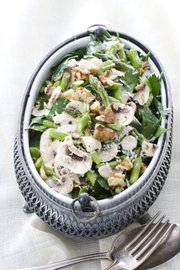 A raw asparagus, mushroom and parsley salad with nuts is a wonderfully flavorful and crisp dish for spring.