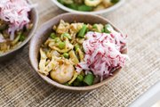 Shrimp Fried Rice with Pickled Radishes features three spring vegetables: peas, sugar snap peas and fresh radishes. You can also switch the shrimp for a different protein of your choice, or use fresh mushrooms for a vegetarian version.