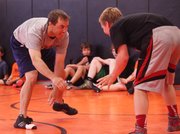 Colby Community College coach Brandon Jobe and BSHS senior Dominic Salvino square off during a June wrestling camp at BSHS.