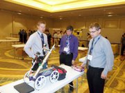 Ben Williams, left, surveys the K-State Chem E Car at a national competition this past month in San Francisco.