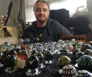 Joshuah Justice shows off his marble creations Saturday at Marble Crazy 2014 in Bonner Springs.