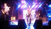 Brandon Magaha (left) along with Chase Peterson, Jonny Welsch and Jeff Hilty perform in Tulsa as Get Busy Living. The group is touring the midwest region every weekend.