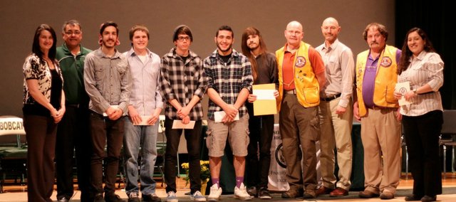 JAG Scholarship recipients pose with Basehor-Linwood Education Foundation and Lions Club members after the Academic Awards Reception April 23, 2014. Left to right: BLEF Vice-President Lori Van Fleet, BLEF President Dave Gunn, recipients: Alex Van Erem, Zach Hamel, Eli Vinson, Johnny Hopper and Kyle Foster, Bruce Adams - Basehor Lions Club, Dr. Doug Bittel, Jim Bishop - Linwood Lions Club, and JAG Specialist Mary Guerra.
