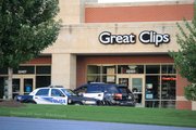 Shawnee Police standing by outside of the Great Clips store at 22403 West 66th Street following an early morning burglary.