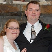 Jon Bieker, pictured with his wife Becky, was killed during an attempted robbery of the She's A Pistol in downtown Shawnee on Friday.