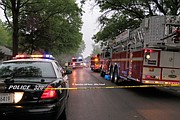 Emergency vehicles lined Lucille Street as firefighters battled the fire.