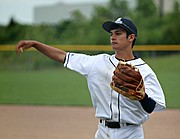 Mill Valley junior Jake Drees plays catch before the Jaguars' regional finals game against Blue Valley Southwest.