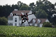 A hexacopter drone is flown by Intelligent UAS, during a drone demonstration at a farm and winery on potential use for board members of the National Corn Growers in Cordova, Md. The small, relatively inexpensive unmanned aerial vehicles could replace humans in a variety of ways around large farms, transmitting detailed information about crops, directing farmers to problem spots and cutting down on the amount of water and chemicals used.
