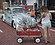 A young mother stops to look at a vintage VW bug at ...