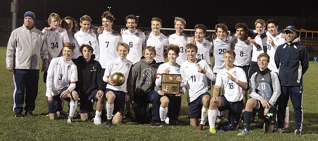 The Mill Valley soccer team gathers for a group photo after its 8-1 victory over Shawnee Heights on Thursday in the Class 5A Northeast regional championship game.