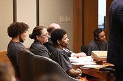 From left, defendants Anthony L. Roberts Jr., Ahmad M. Rayton and Dominique J. McMillon listen to testimony, Friday, Jan. 19, 2018, during the second day of a preliminary hearing for charges related to an October 2017 triple homicide on Massachusetts Street.