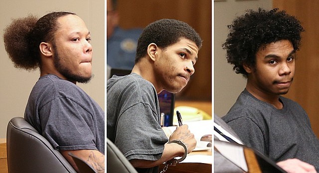 From left, defendants Anthony L. Roberts Jr., Ahmad M. Rayton and Dominique J. McMillon sit during a joint preliminary hearing, Thursday, Jan. 11, 2018, for charges related to a October 2017 triple homicide on Massachusetts Street.