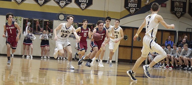 St. James sophomore leads the Thunder in transition during the first half of their 55-53 loss to St. Thomas Aquinas on Tuesday.