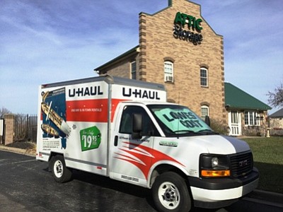 Pictured is a U-Haul truck in front of Attic Storage. The company recently  signed on as a U-Haul dealer.