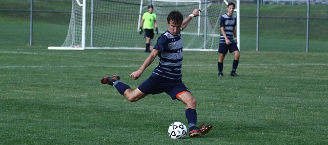 Mill Valley senior Jake Ashford kicks the ball during the Jaguars' 1-0 victory over St. James on Tuesday. Ashford scored the lone goal of the match.