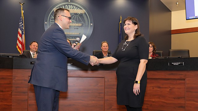 Lisa Larson-Bunnell is sworn in as the new Ward 3 Shawnee city council member by Deputy City Manager Stephen Powell at the council meeting on Tuesday evening.