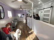 Here is a view of Wizard of Paws looking out at the play area. Cami Jo, the family poodle, looks on.