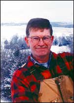 Weather has always been an interest of Charles Perry, and he
doesn't use a groundhog to forecast it. He is pictured more than 40
feet above ground on the wind generator at his home northwest of
Baldwin.