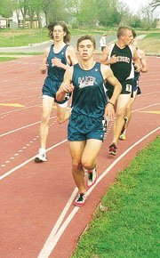 Baker University's Cole Gladhart, center, runs during Saturday's
3,000-meter event at the Baker Relays. Baker won both the men's and
women's portions of the meet.