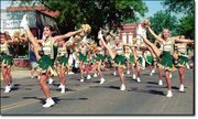 The Basehor-Linwood High School cheerleaders entertain the crowds
during the Tiblow Days parade Saturday, Aug. 25, in Bonner Springs.
The group was among dozens of entries that performed in the
two-hour parade. The Basehor-Linwood High School band also
performed during the parade.