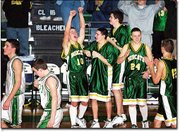 Basehor-Linwood guard Eric Laffere, No. 10, raises his arms in
celebration as the final horn sounds on the Bobcats' first win of
the season Friday, Jan. 11, at De Soto. Joining Laffere in
celebrating are, from left, John Shumaker, Jake Augustine and
Brandon Dye.