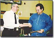 Mayor John Pfannenstiel presented Bob Vervaecke with a plaque and
key to the City of Basehor. Vervaecke served on the Basehor City
Council for over five years, serving as council president for three
years. He also served on the planning commission for two years. For
more photos, see page 12A.