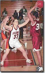 AMANDA BERRY looks to defend a pass against a Washington opponent
in Thursday's 44-42 semifinal win.