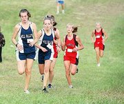 Mill Valley runners Hillary Johnson and Aubrey Hale take on the
last hill at the Cat Classic in Shawnee Mission Park. Johnson took
sixth place at the meet, while Hale finished in eighth place.