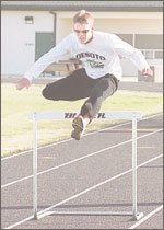 DeSoto junior Brad Buser clears a hurdle during a recent practice.
The Wildcats, who finished third at their league meet last year,
have the talent and depth to compete this year for a Kaw Valley
League title and perhaps much more.