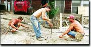 Bob Lewis, Keith York and Tim York of Stafford Construction work on
laying a new sidewalk in front of the DeSoto community center on a
hot summer afternoon. Although the hot weather made working outside
miserable, workers said the key to surviving was taking frequent
water breaks and staying in the shade as much as possible.