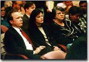 Oz Entertainment Co. President Robert Kory and Oz board member Jo
Bourjaily react as it bcame clear the Johnson County Commission
would not approve the company's redevelopment plan for the
Sunflower Army Ammunition Plant.