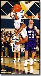 Mill Valley senior Dominique Burgin looks for a pass as he falls
out of bounds during the Jaguar's victory against Piper on last
Friday night. On Tuesday night, Burgin had a team-high 10 points in
the Jaguar's 54-50 victory.