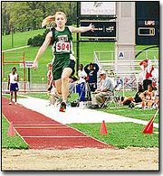 De Soto High sophomore Julie Beck competes in the long jump at the
KU Relays. Beck missed qualification in Friday's final by a few
inches.