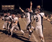 Eudora football players Tim Durkin, Chad Krutz, Richard Wilks, Kent
Swanson and Austin Hoover celebrate another win in their undefeated
season after beating Atchison Saturday 20-12 to claim the Class 4A
sectional championship. Eudora will face Girard in the next round
of state playoffs at 7 p.m. Friday in Girard