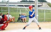 Morgan Abel, a member of the Eudora Blue team, took this pitch to
center for an RBI single in the top of the third in the
championship game of the 11-and-12-year-old Big 4 League Tournament
over the weekend. He also pitched the 11-2 victory.