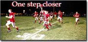 The Cardinals celebrate as they leave the field after a hard-fought
23-22 victory over Prairie View. The victory brings Eudora one win
away from capturing a share of the Frontier League chapionship.