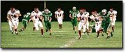 Roger Nomer/The Eudora News Senior running back Sam Campbell (24)
breaks away from a line of DeSoto defenders on his way to one of
his three touchdowns. Campbell had a break out game as he rushed
for 192 yards in the game.
