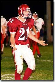 Junior quarterback Ronnie Morlan voices his frustration after being
sacked by Hiawatha defenders. Morlan is one of many starters
returning to the Cardinals lineup next year.