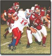 Showing his defensive skills, senior defensive back John Powers
tackles a Wellsville runner during a late season league victory.
After graduation, Powers will probably attend Kansas University
next fall.
