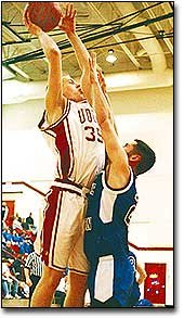 Eudora High junior Wes Hinman takes on a Gardner-Edgerton player as
he leans in for a basket. Hinman scored 14 points in Tuesday
night's game.