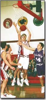 Eudora junior Lear Bowling puts up a shot over a Baldwin defender
during the Cardinal's upset victory of Baldwin Saturday afternoon.