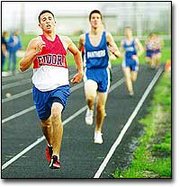 Senior Aaron Slavin tries to make up some ground on the backstretch
of the track during the 1600m run. Slavin took third in the event
with a time of 4:55.19.