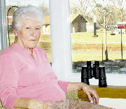 The birds that visit the bird feeder and bath in the yard of Myrtle
and Leon Coker are a window to the past for Myrtle. The birds
remind of her childhood home on a farm razed for the construction
of the Sunflower Army Ammunition Plant.