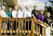 Gathered for a photo on Margie McQuitty's autumn-decorated porch
are, from left, Shirley Walbridge, Edna Sullivan, Gloria Packer,
Betty Scott, Mary Seufert, Margie McQuitty, Charlene Wagner and
Charlotte Robinson.